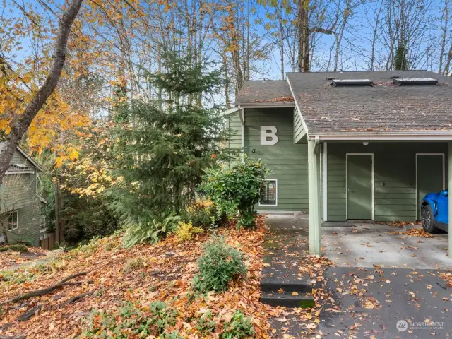 Lovely townhome with covered parking & storage shed.