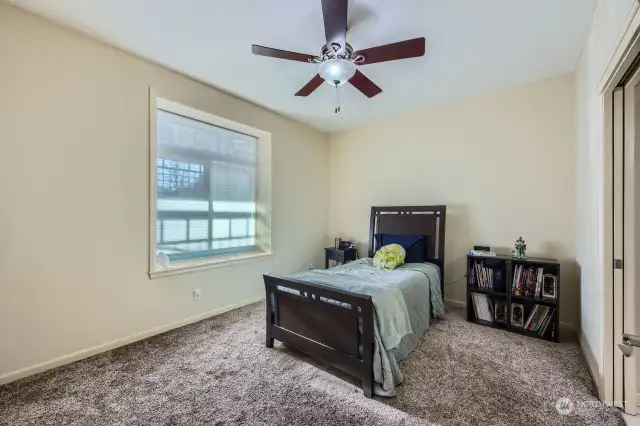 Primary bedroom includes a private bath and walk-in closet