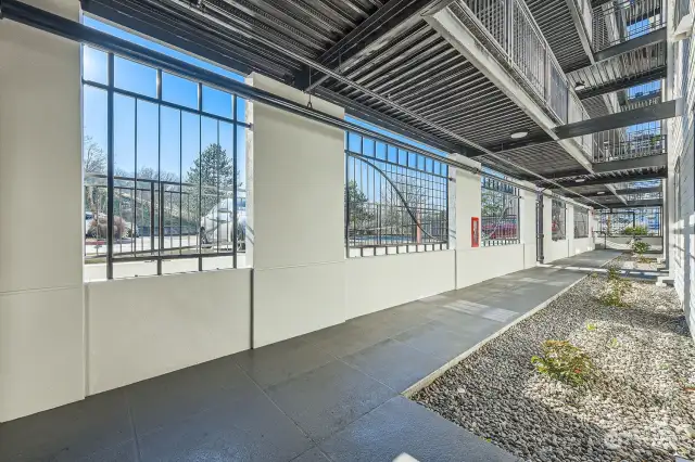 Ground level home with covered walkway.