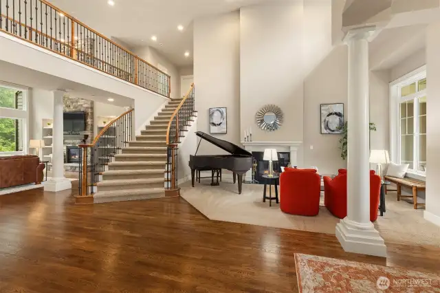 Formal Living room with a gas fireplace. Sweeping hardwoods throughout the lower level.