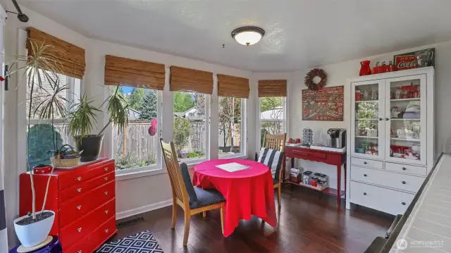 Additional dining space just off the kitchen filled with natural light