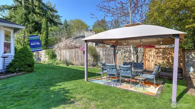 Fully fenced backyard offers privacy and a perfect space for pets, children, or guests
