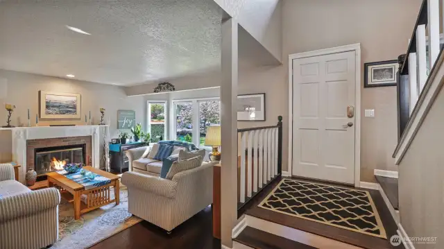 Step into a welcoming open floor plan with a smooth flow, offering effortless access to the living room and stairs