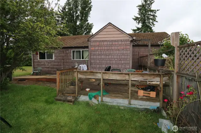 Outdoor deck space at the rear of the home.