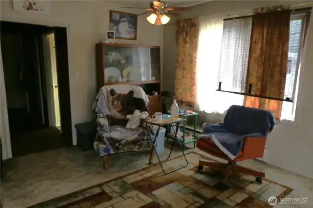 Another angle of the living area, with the front door just out of view to the right.