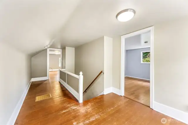 Large landing space upstairs could make a cute little office space or crafting nook.