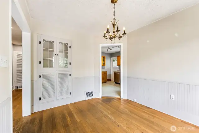Dining room looking towards kitchen. Check out that built-in. So cute!