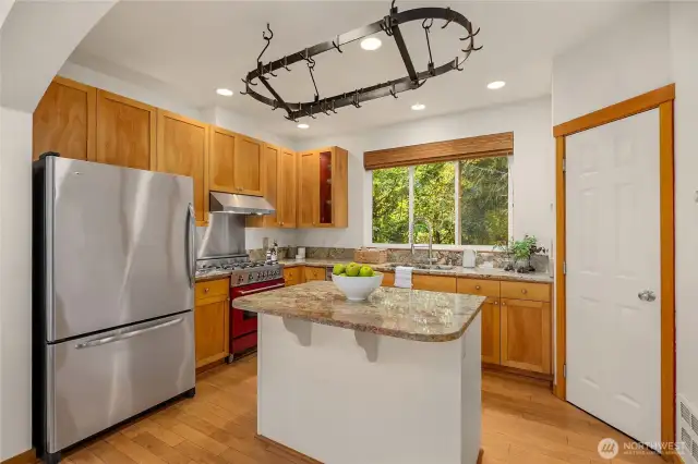 The cook's kitchen features stone countertops, pantry, and additional built-ins for storage (not shown in photos.)