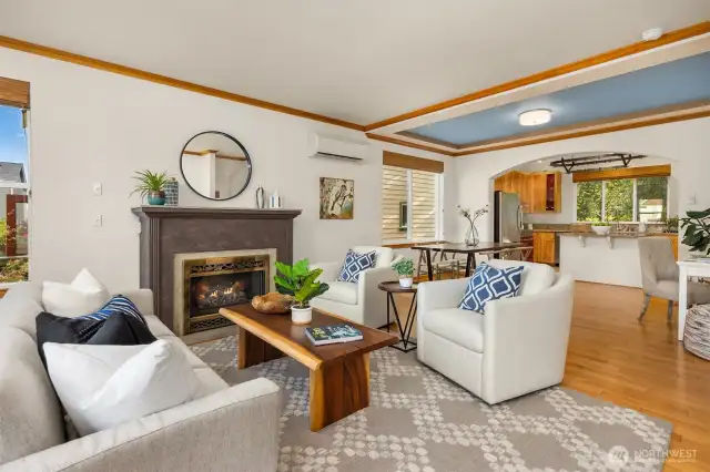 A propane fireplace with stone surround and mantle anchors the living room.