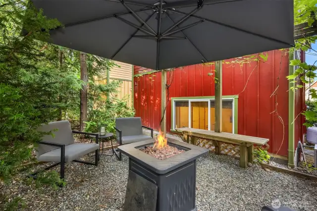 To the rear of the home find this sweet garden/patio with room for entraining and relaxing.