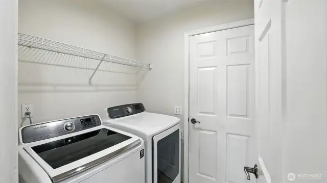 Full size laundry area with pass-through to garage