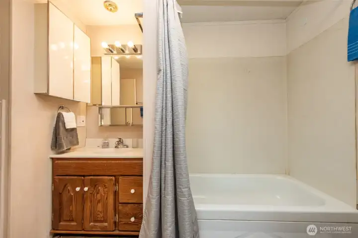 Full bathroom with tub and shower
