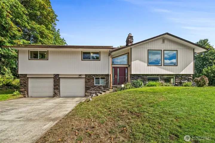 Love the clean classic lines of this home on 5 acres!