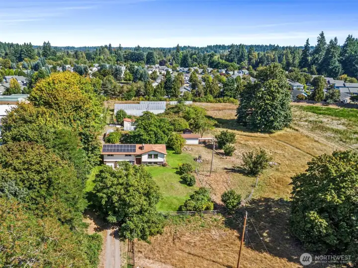 An overhead look at your lovely & close-in country lifestyle property. The home features rooftop solar, on-demand generator, ductless heating/cooling and dual pane windows for efficiency and peace of mind.