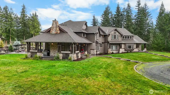 A secluded covered porch designed to be enjoyed in every season, rain or shine.