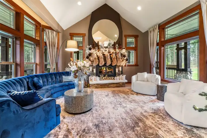 Family Room with wood fireplace, and wood wrap windows throughout