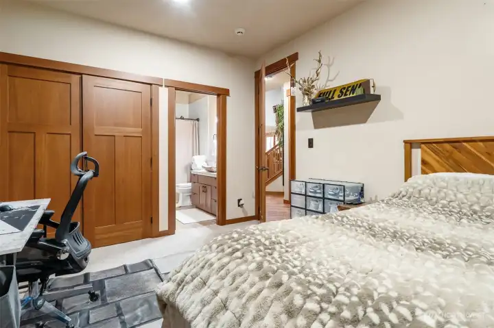 Convenient main-floor bedroom featuring stepless entry and a walk-in shower