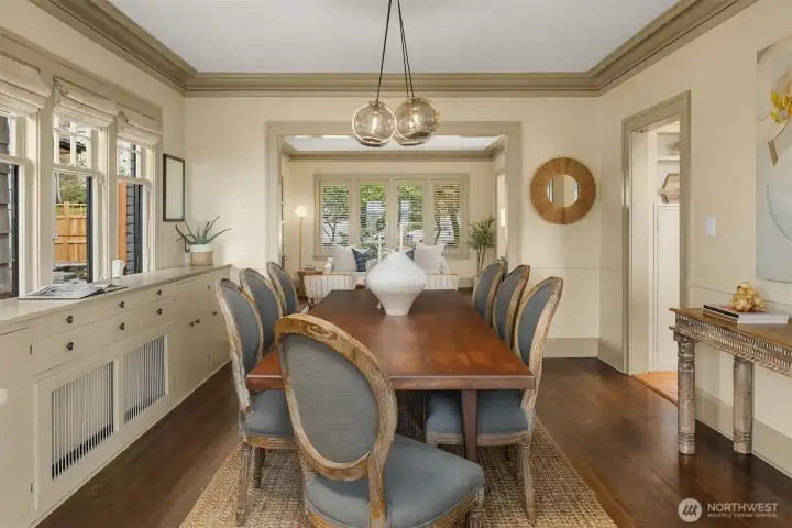 Large formal dining room with built in cabinets.