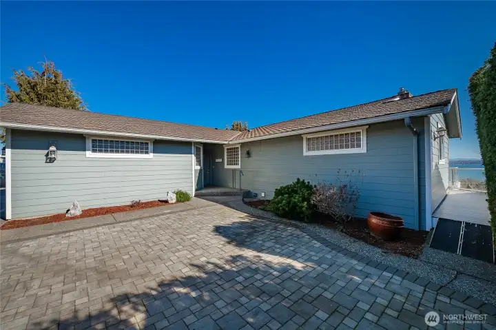Private paver courtyard at the entry. See deck entry mini ramp.