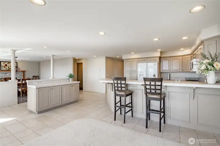 Good picture shows transition to the dining room with fireplace and view.