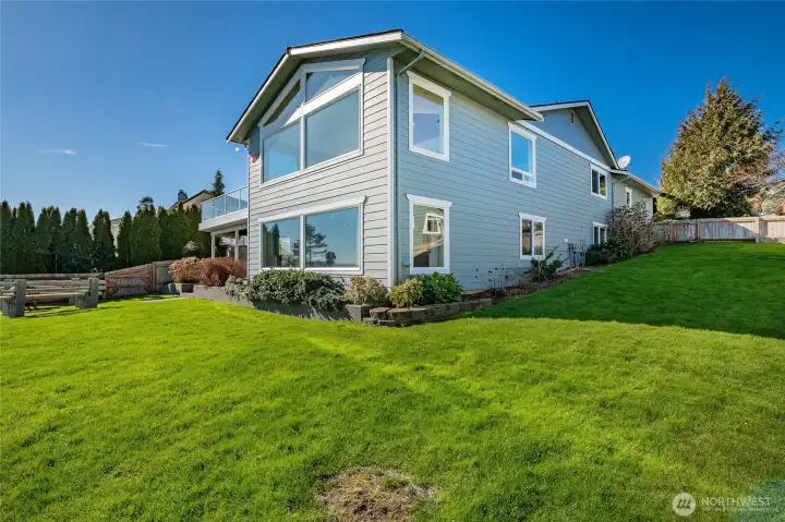 Wrap around yard. This home has a long term composition roof, and Hardie siding.