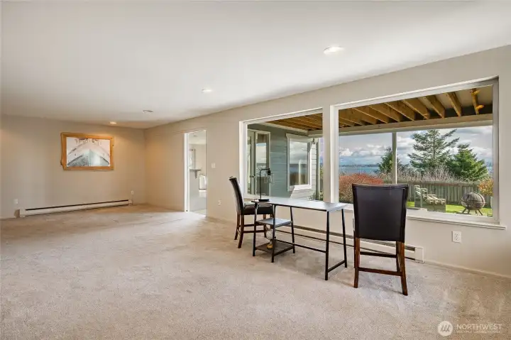 Room at the garden level with gas fireplace. Both fireplaces have blowers. Nice views from this level as well.