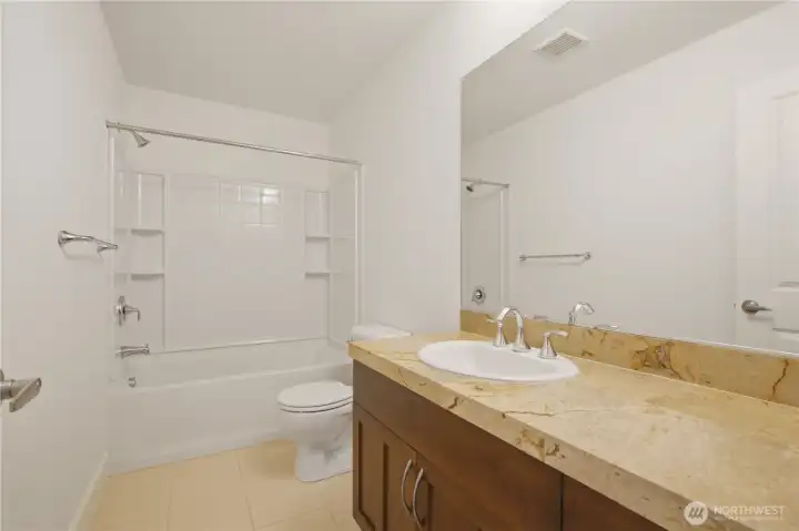 Full bathroom with tub and shower