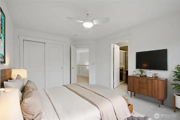 Primary bedroom 2 with ceiling fans and an ensuite bathroom