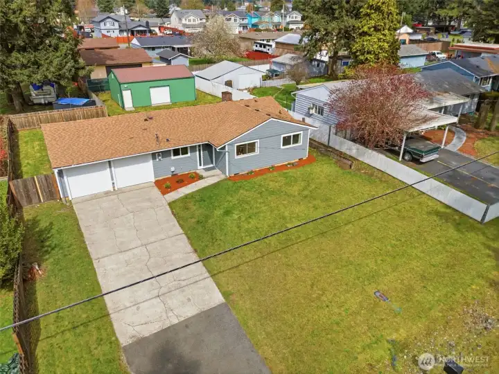 This home is situated on a large lot with alley access in back to a spacious 3 bay shop!