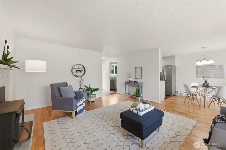 Another angle showing the layout of the living room and dining area.
