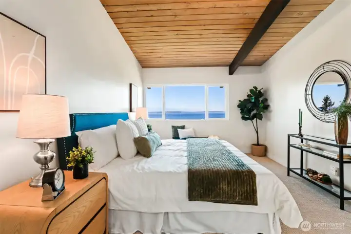 The large primary bedroom and that view you can't escape.