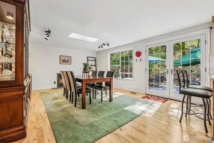 Family Room being used as a dining room. French Doors to rear patio - open up the spaces!
