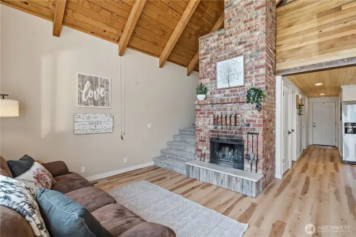 Living Room and Stairs Leading up to Primary Loft Syle Bedroom