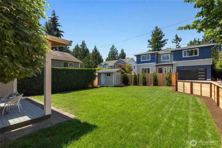 Irrigated landscaping with low maintenance vegetation, fully fenced backyard complete with garden/tool shed