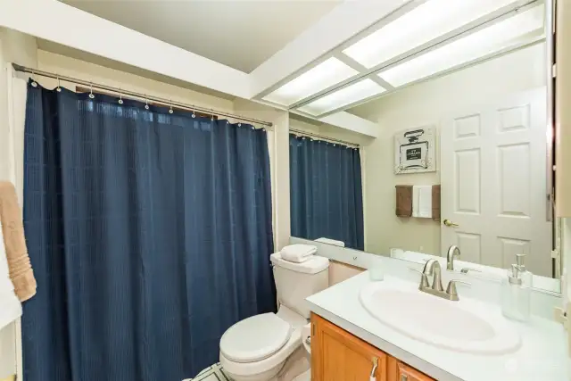 Main bathroom with tub and shower