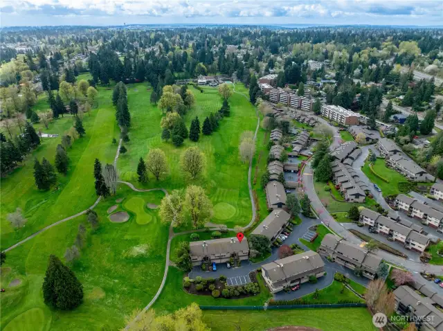 Overhead looking south up to the clubhouse from your new home under the red pin, and as you can see here there are 5 guest parking spots located by your front door