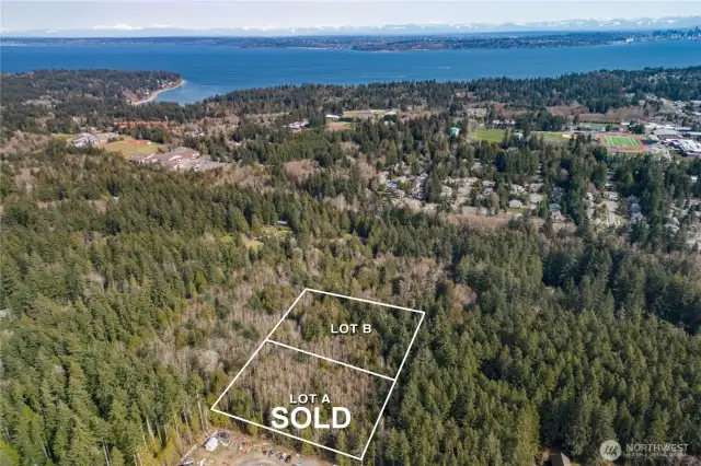 Lot B sky shot, Fox Den road seen along the right side of the property line out to Sportsman