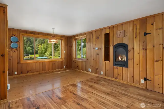 Dining room featuring built in storage and fireplace.