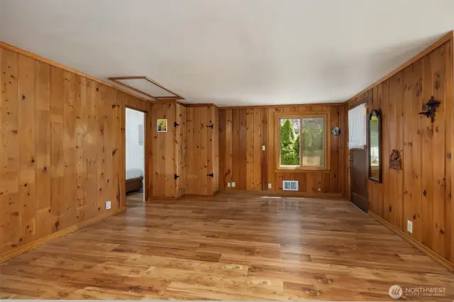 Spacious living room with windows allowing natural light to flow throughout.