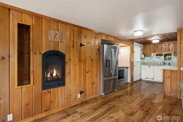 Kitchen with pantry door next to fridge allowing for additional storage space.