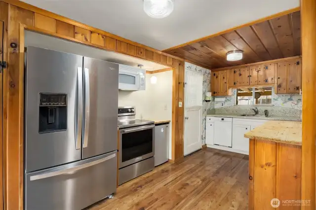 Kitchen with ample counter space and cabinets for storage.