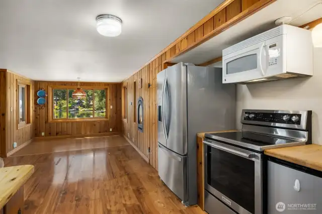 Kitchen flowing seamlessly into living space.