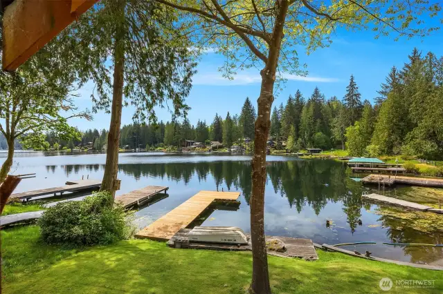 Lower yard leading to lake access via dock.