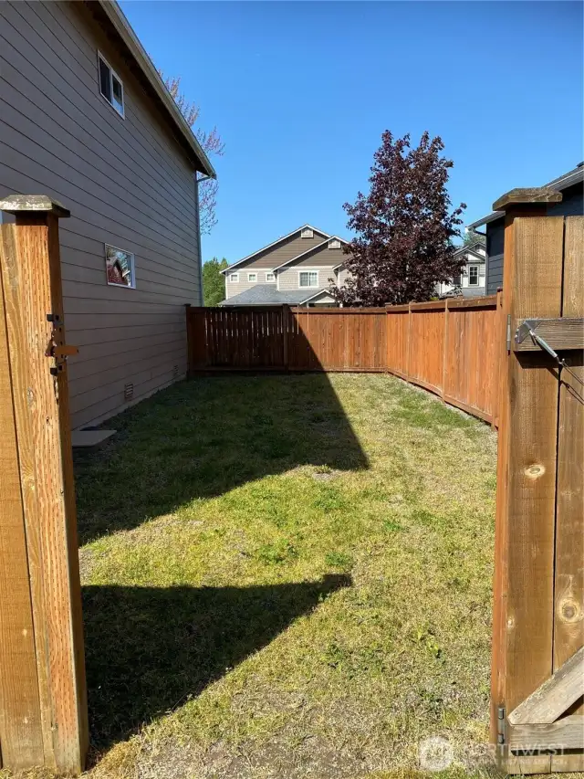 Dog run or optional RV parking on side of home