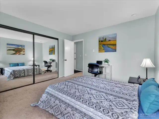 Mirrored double sliding closet doors with ample hanging space