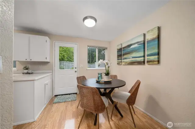 Kitchen nook with access to back patio and small yard
