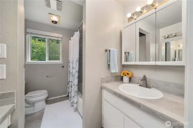 Full bath with dual vanities