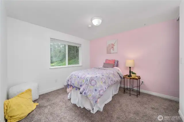 secondary bedroom with walk in closet on the right