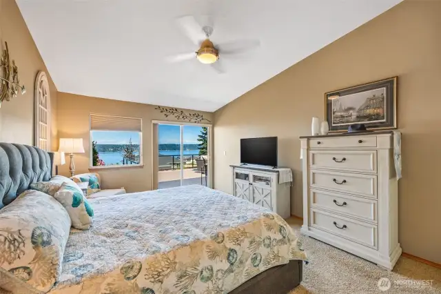 The dreamy primary bedroom offers private deck access, bay views, a spa-inspired ensuite with soaking tub, and a generous walk-in closet—your personal retreat awaits.