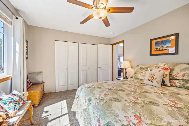 Your guests will love this cozy main-floor bedroom, set apart from the primary suite and right next to a full bath. The home’s thoughtful floor plan offers privacy, flexibility, and so much more downstairs.